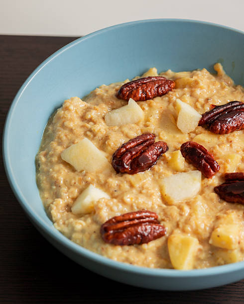 istock creamy pumpkin oatmeal topped with fresh apple slices and caramelized pecans 2242360873