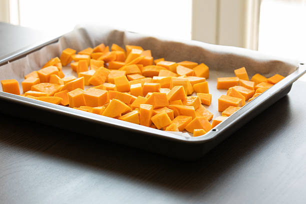 istock chopped bite size butternut squash pieces on tray raw and fresh close up 2242360883