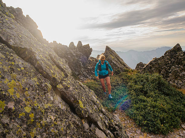 istock Mountain athlete among cliffs overcoming the difficulties of the path 2242361532