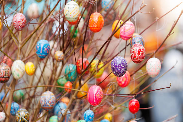 istock Colorful Easter eggs hanging on delicate branches bring joyful spring mood with intricate patterns and vibrant colors. Bold designs radiate festive spirit, symbolizing rebirth and timeless tradition 2242363056