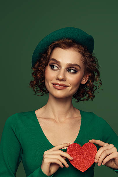 istock Holding Love Close: A Radiant Smile with a Heartfelt Touch 2242367575