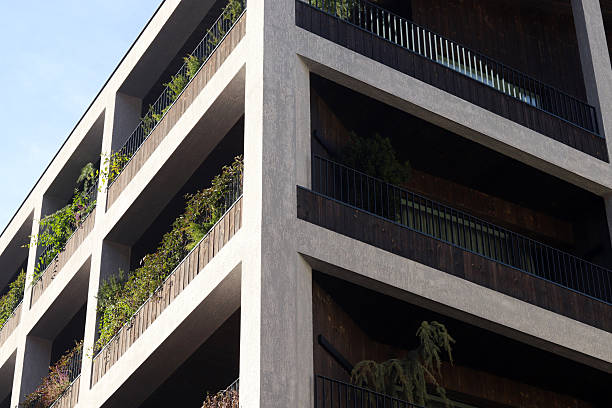 istock Modern architectural building with lush greenery on each balcony 2242371895