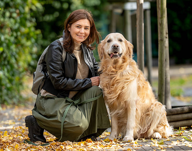 istock Woman'S Portrait With Golden Retriever 2242375314