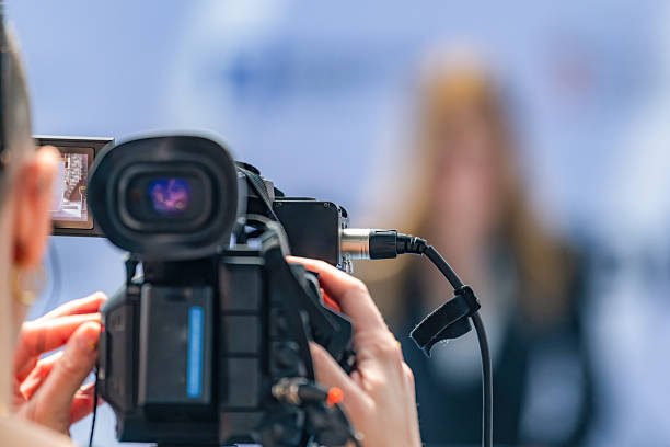 istock Camera at press conference records key statements, ensuring accurate media coverage. Its precise footage preserves critical details, supporting transparent public communication. 2242376345