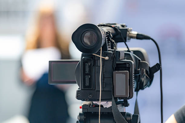 istock Cameraman at a press conference ensures accurate media coverage. Their precise footage preserves critical moments, supporting transparent public communication. 2242376382