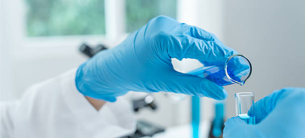 istock Scientist analyze biochemical samples in advanced scientific laboratory. Research and development staff use dropper mix microbiological developmental of perfume. Biotechnology research in science lab 2242377174