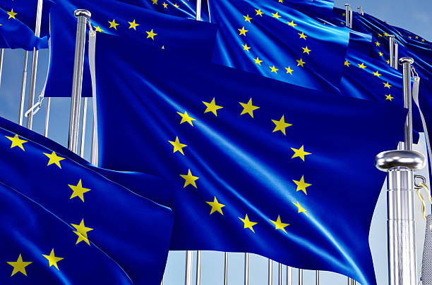 istock Many european union flags over blue sky background. 2242377989