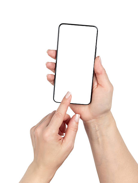 istock Female hands holding smartphone with blank white screen isolated on white background. Modern mobile device mockup for app design, business presentation or advertising concept. Clipping path included. 2242383730