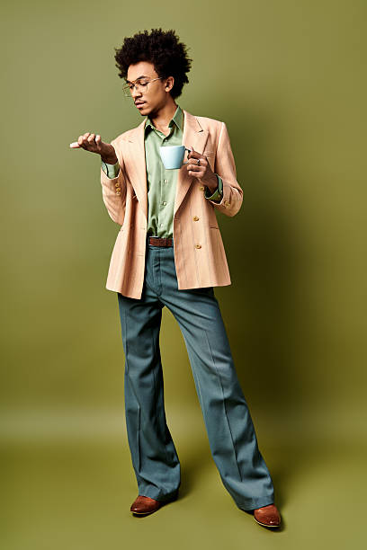istock Stylish young man enjoying coffee in a trendy setting 2242385017
