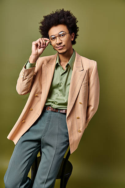 istock Young stylish man expresses emotions with confidence in a modern setting 2242385826
