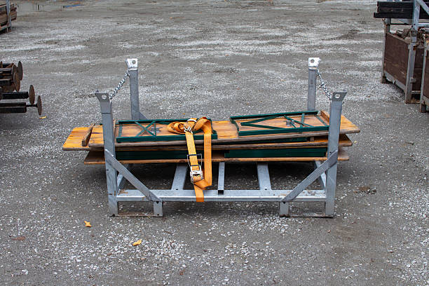 istock Beer garden tables secured on a rack, ready for outdoor events in park setting 2242387135