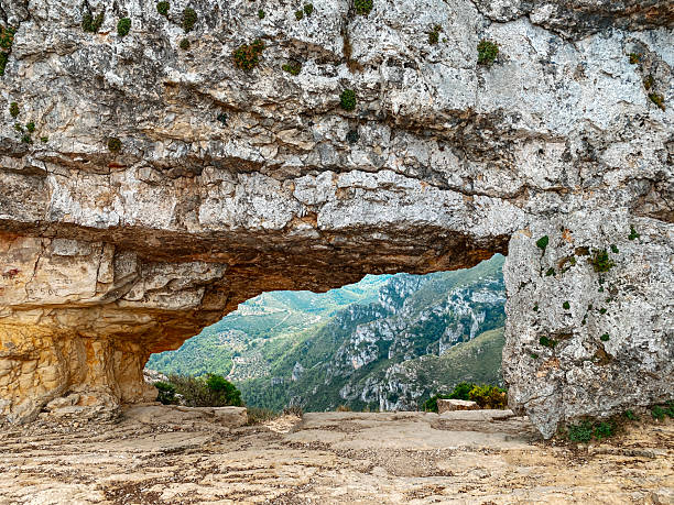 istock view through La Foradada arch in Serra del Montsia 2242388087