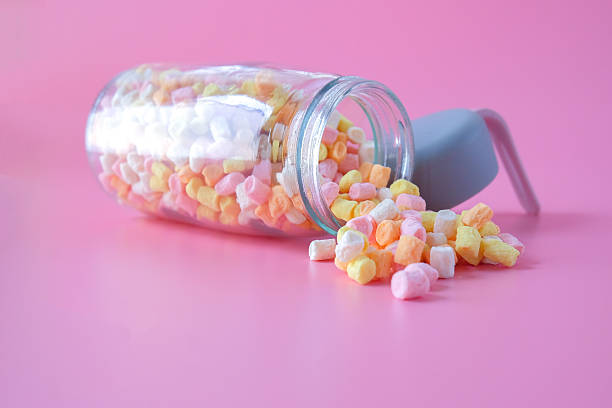 istock Colorful sweet candy in bottle on background. 2242388691