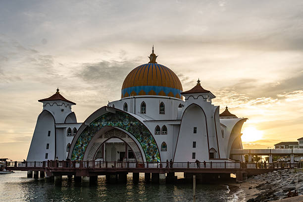 istock Malacca straits floating mosque illuminated by golden sunset 2242392444