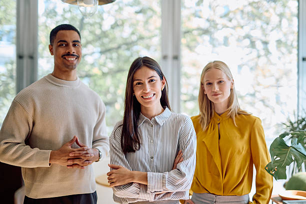 istock Diverse business team smiling portrait inside office 2242399945