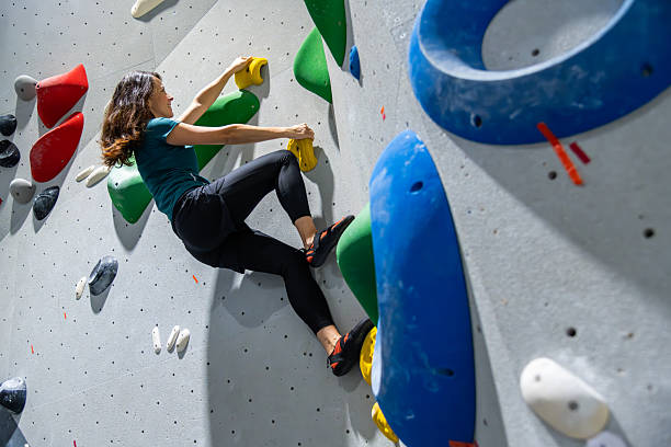 istock Female Climber On Indoor Rock Wall Training 2242400772