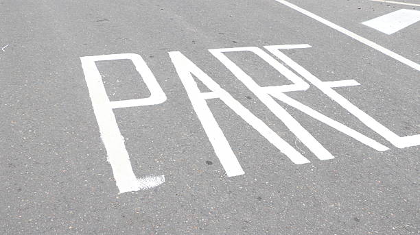 istock Road marking and maintenance work with paint, asphalt and reflective tacks 2242403117
