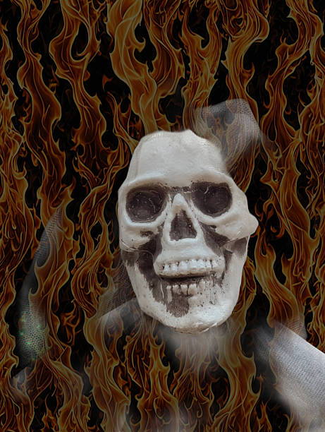A skull stands at the center of the scene, surrounded by vivid flames in a dark background. The combination creates an eerie yet captivating effect, evoking feelings of mystery and intrigue.
