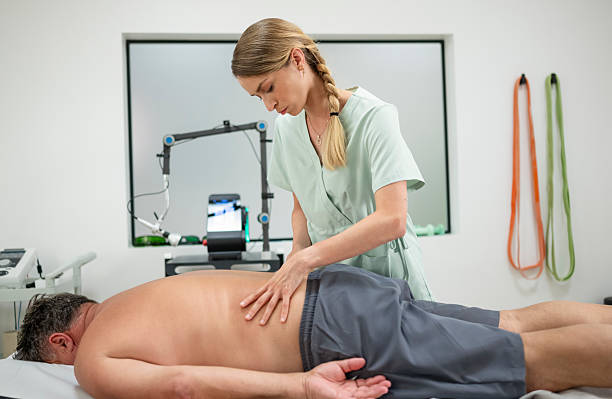 istock Physical Therapy Assessment with Mature Male Patient 2242404714