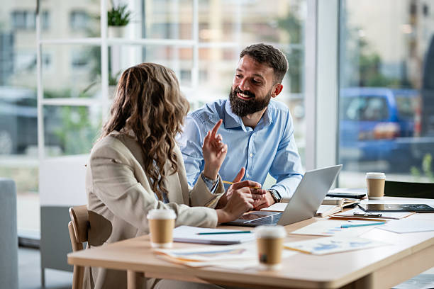 istock Business colleagues collaborating on project in office meeting 2242405000