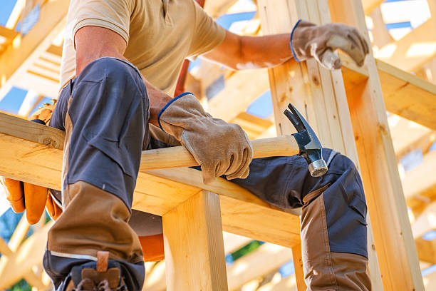 istock Skilled Carpenter Working on Wooden Structure at Construction Site During Day 2242405394
