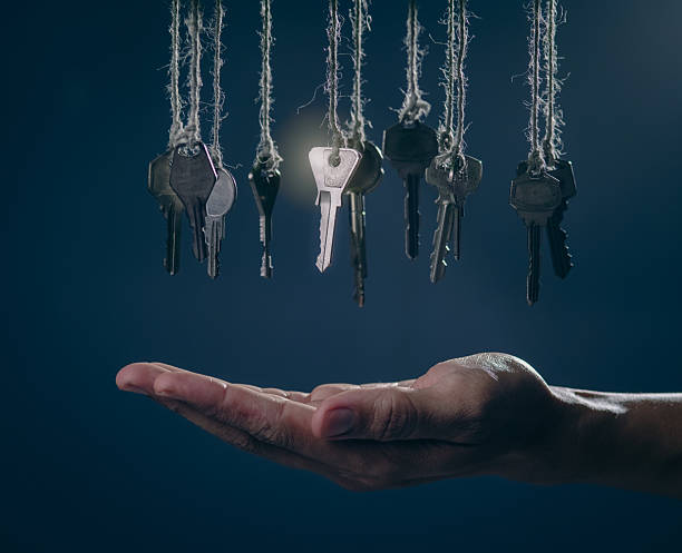 istock Open Hand Reaching for the Glowing Key: Solution, Opportunity, and Success Concept 2242406942
