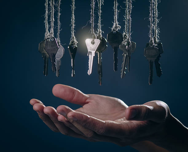 istock Open Hand Reaching for the Glowing Key: Solution, Opportunity, and Success Concept 2242406943