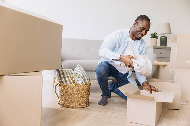 istock African man packing household items moving new home 2242408740