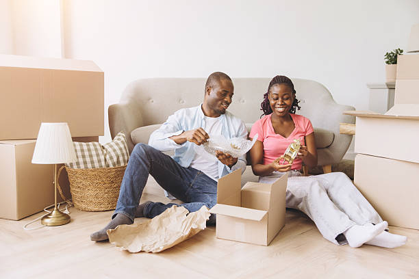 istock African couple unpacking boxes in new house moving day 2242409062
