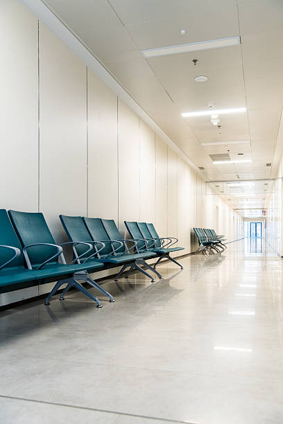 istock Empty corridor in modern hospital with waiting area 2242411121