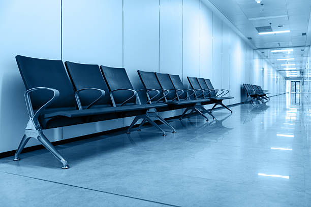 istock Empty corridor in modern hospital with waiting area 2242411146