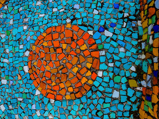 Colorful mosaics of broken tiles form swirling circles, abstract fields, and playful figures.