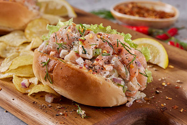 Creamy Shrimp Salad  Sliders on Soft Buns with celery, Green Pepper, Chili Flacks a squeeze of Lemon Juice and Potato Chips