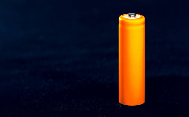 Orange AA battery. Electricity charging. Battery for toys, electronics and equipment. Backup power supply.
