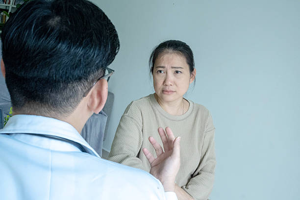 istock Caring Doctor with Patient in Clinic 2242411850
