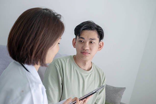 istock Asian Doctor Explaining Diagnosis to Patient 2242413013