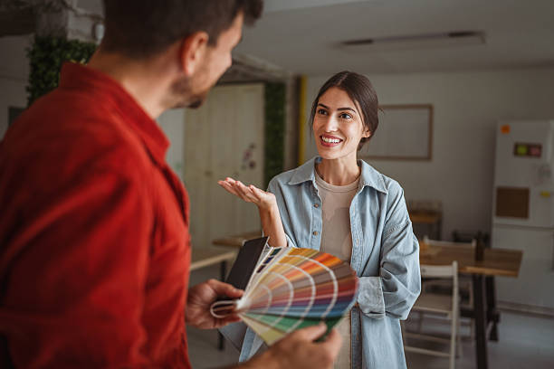 istock Interior designer showing color swatches to client during home renovation project 2242413453
