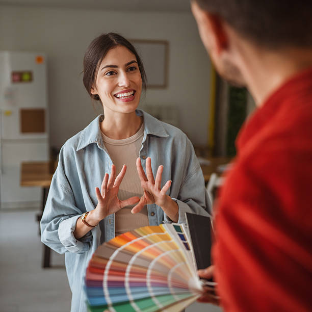istock Interior designer showing color swatches to client during home renovation project 2242413564