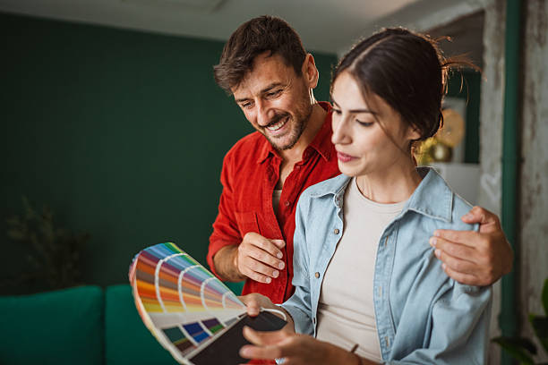 istock Couple choosing paint color for home renovation project 2242413771