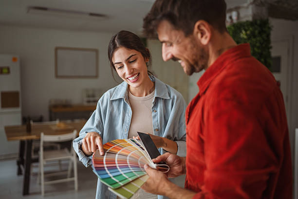 istock Interior designer showing color swatches to client during home renovation project 2242413869