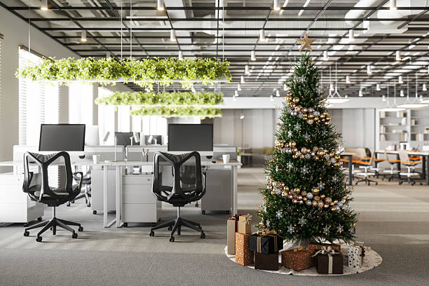 istock Modern Office Decorated for Christmas with Tree and Gifts 2242414845