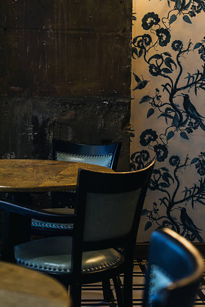 istock Cozy Cafe Interior with Artistic Wallpaper 2242418476