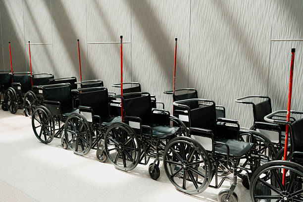 Row of empty wheelchairs waiting at an airport, symbolizing mobility assistance and accessible travel for passengers with disabilities