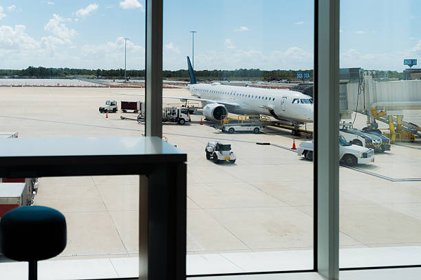 istock Airport terminal view overlooking airplane and tarmac 2242421587
