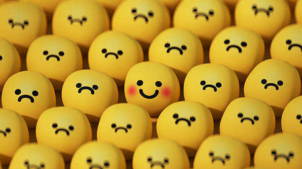 istock Happy smile face in the sad crowd 3D render 2242421752
