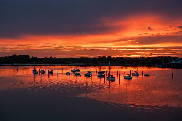 istock stunning sunset over water with yachts moored 2242422211