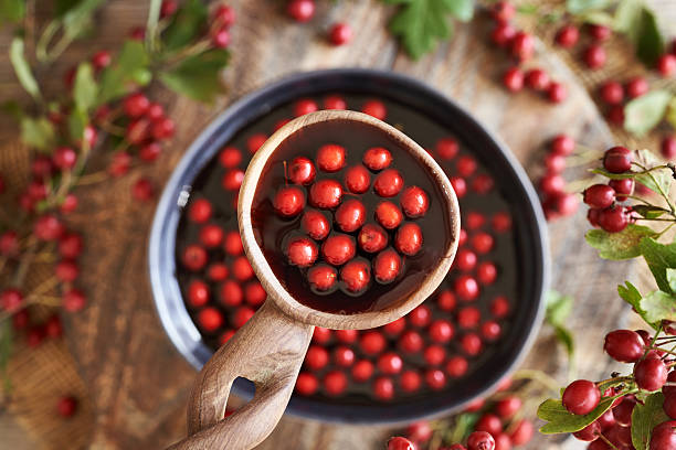 istock Healthy medicinal wine made with fresh hawthorn berries 2242423325