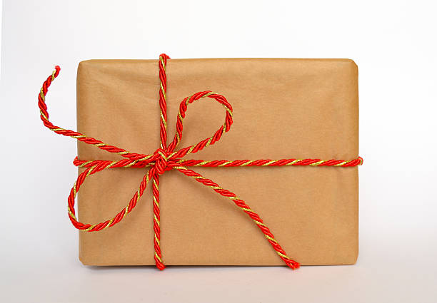 Gift in craft paper on a white background. High quality photo