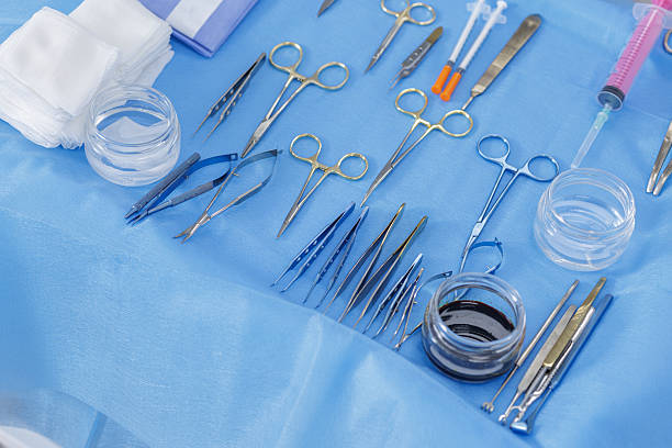 istock Oculoplastic and facial surgery instruments organized on a sterile blue drape 2242433449