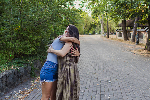 istock Connection and bonding between two female friends in the public park. 2242437090